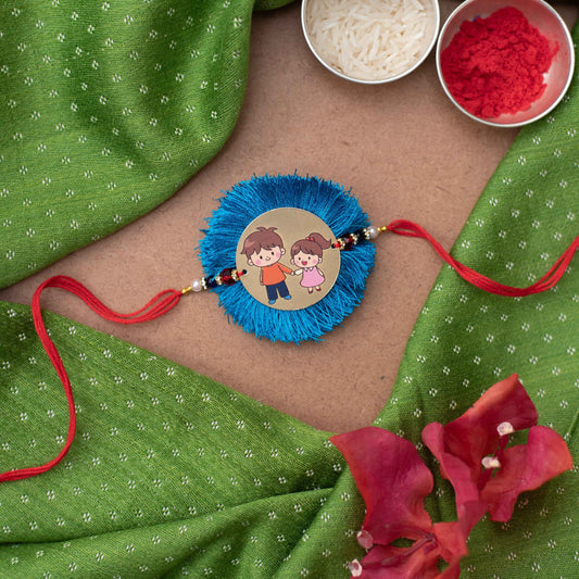 Handmade Rakhi with a cute Brother & Sister charm #2 - Blue, Gold, Red