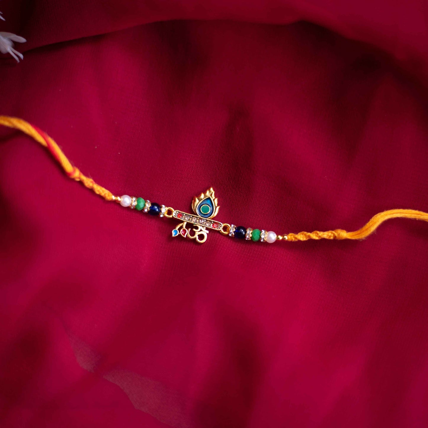 Handmade Peacock charm Rakhi with beads & macramé detailing,. - Green, Red, Yellow